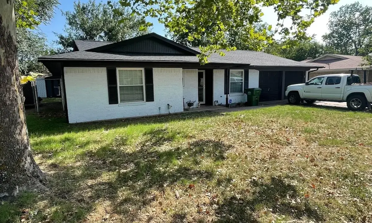 Professional roofing crew working on a residential roof in Dulles Town Center